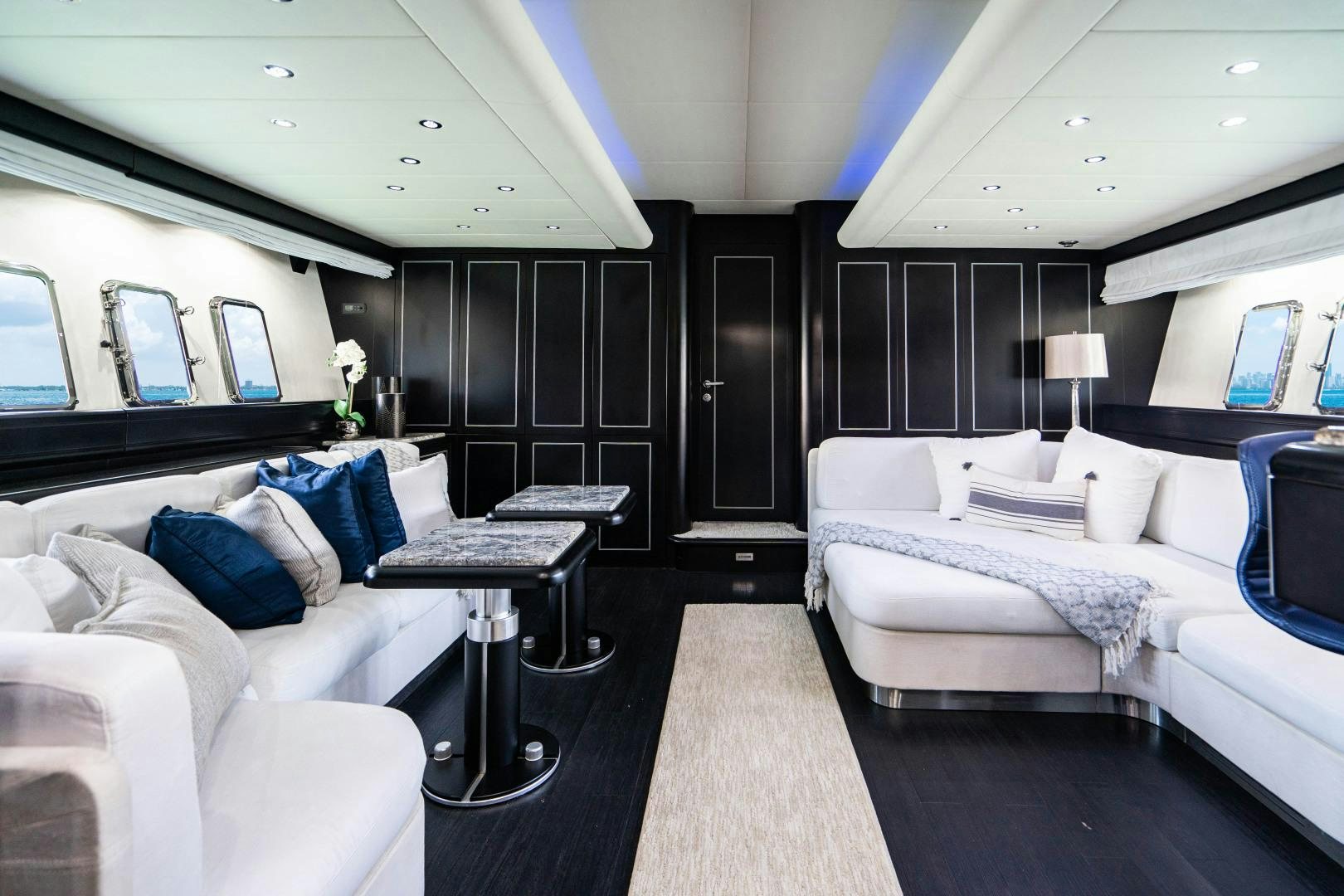 a room with a bed and a desk aboard IV GIOCARE Yacht for Sale