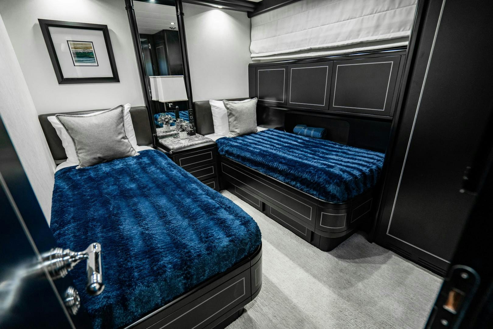a room with a couple of beds aboard IV GIOCARE Yacht for Sale