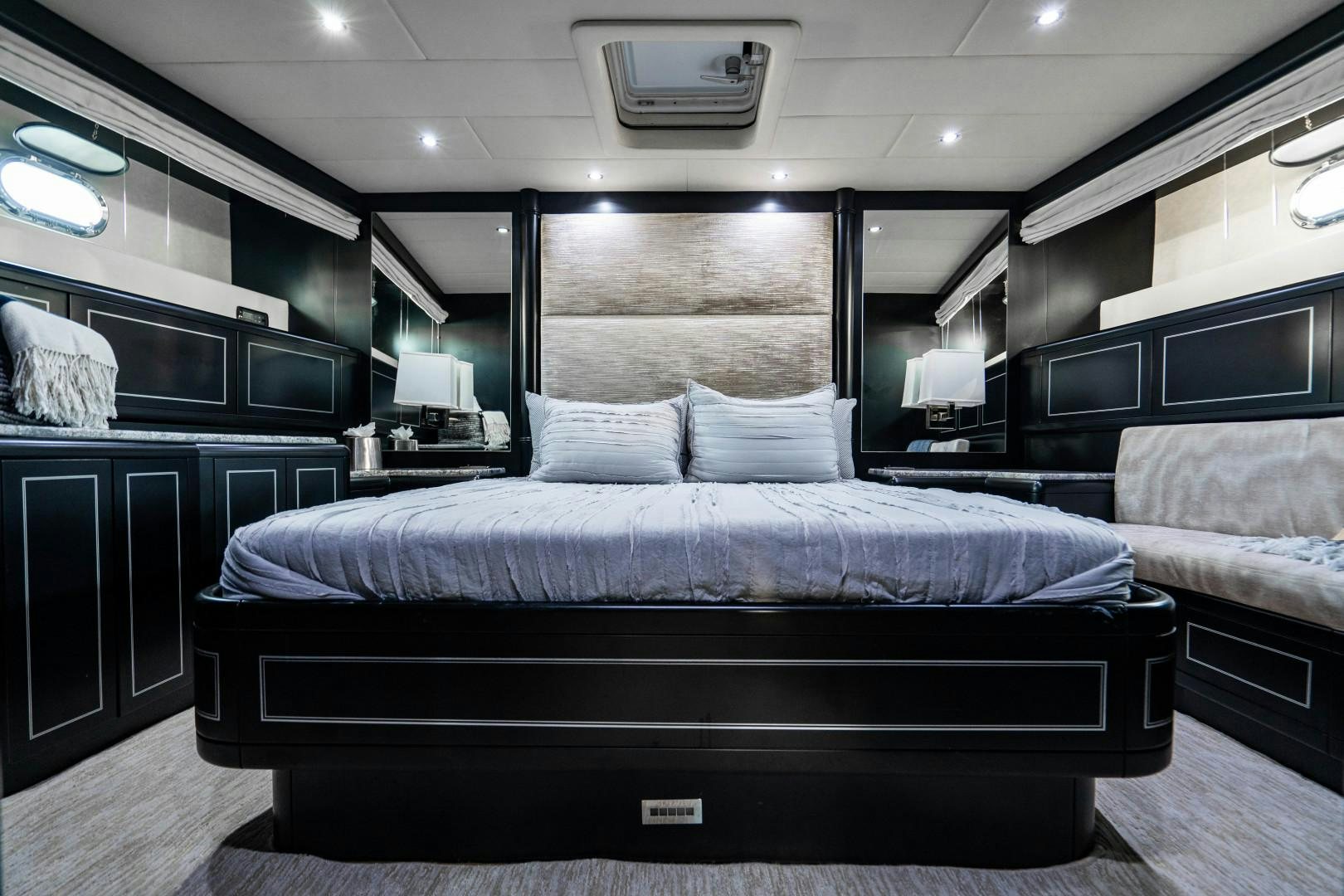 a large bed in a room aboard IV GIOCARE Yacht for Sale