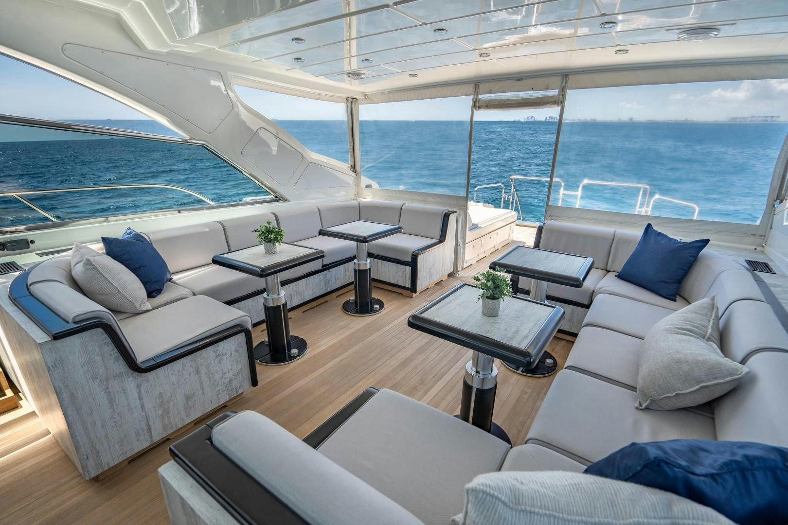 a living room with a large window aboard IV GIOCARE Yacht for Sale