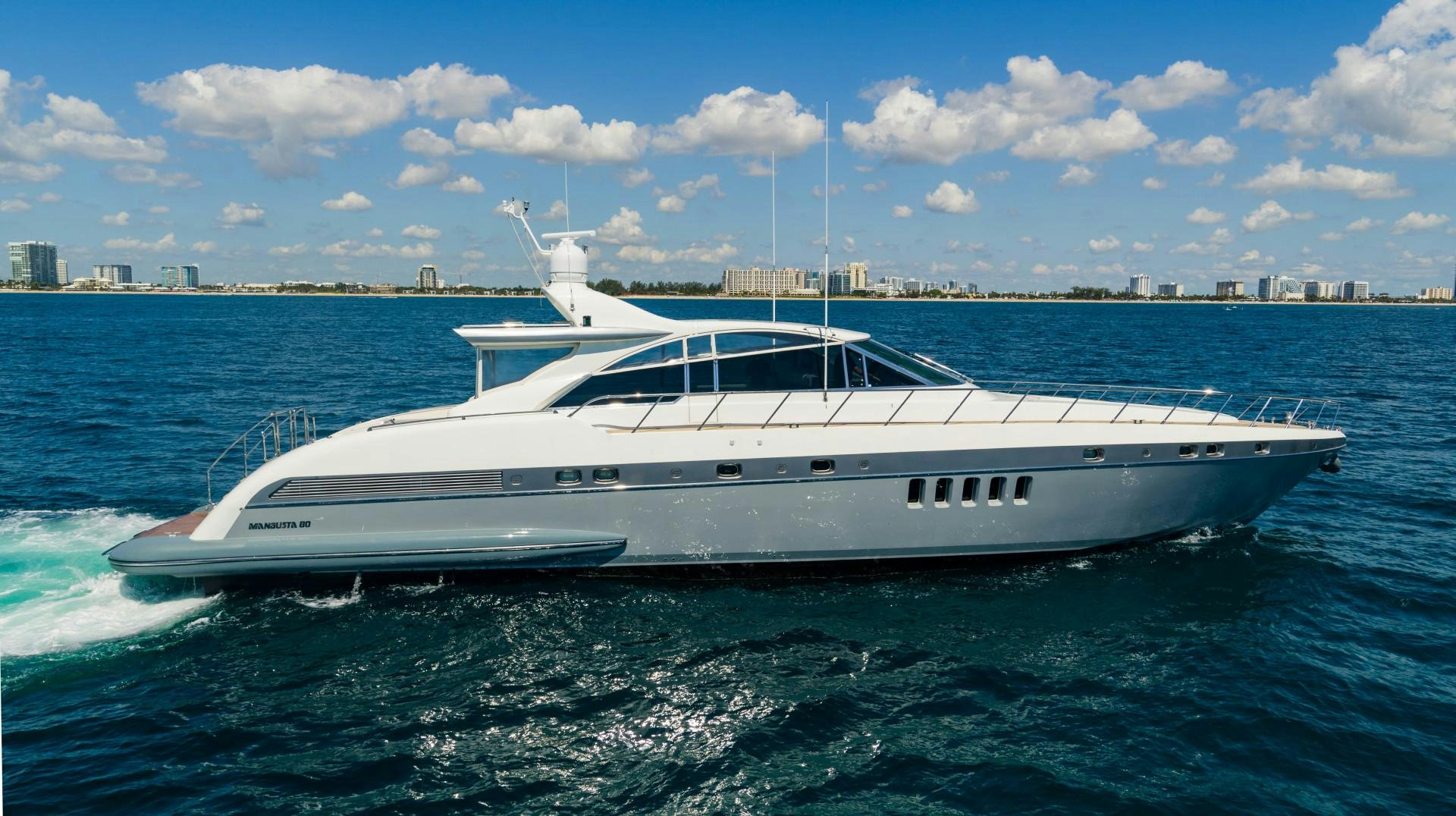 a white yacht in the water aboard IV GIOCARE Yacht for Sale