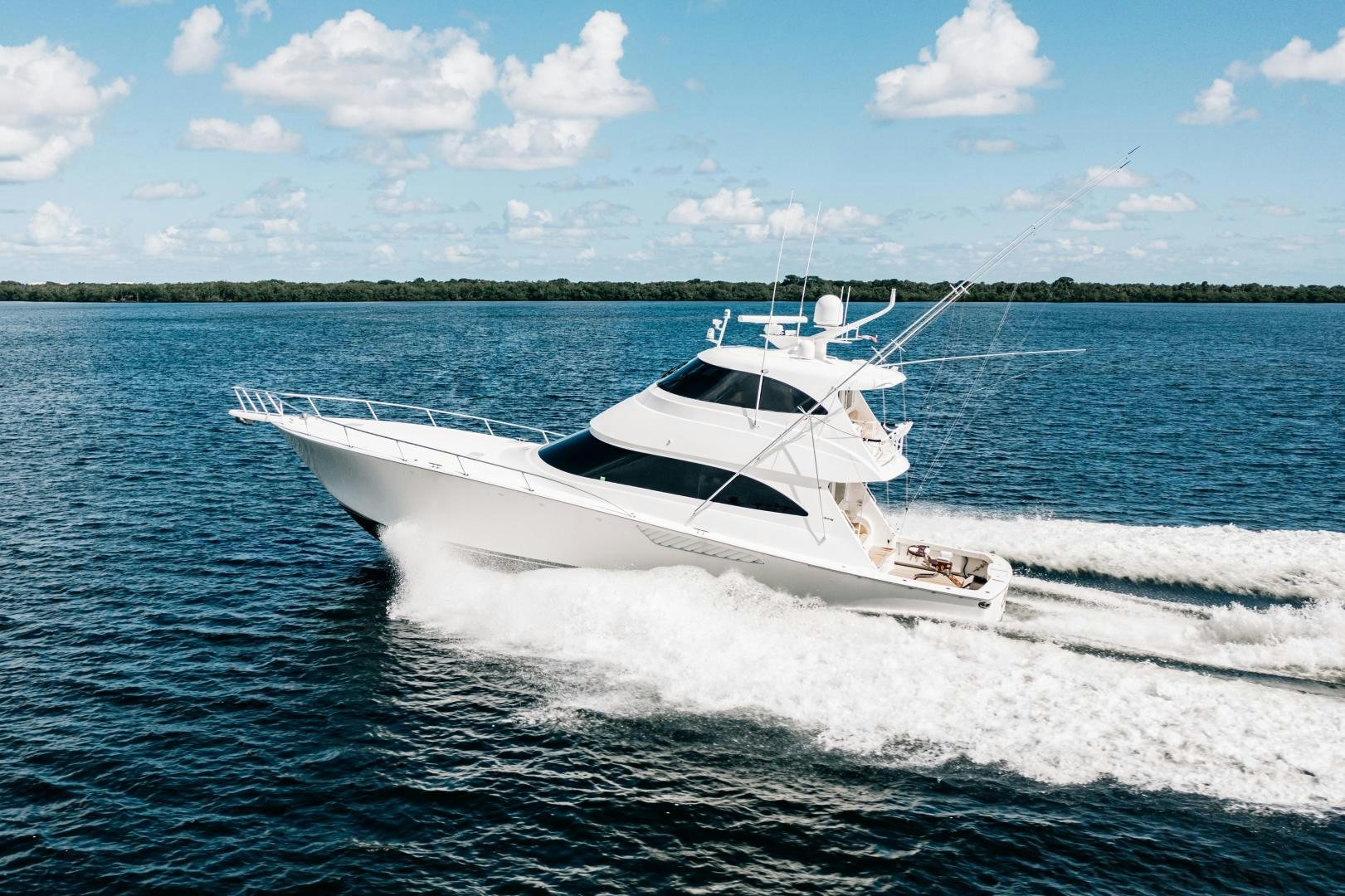 a white boat on the water aboard SUNSHINE Yacht for Sale
