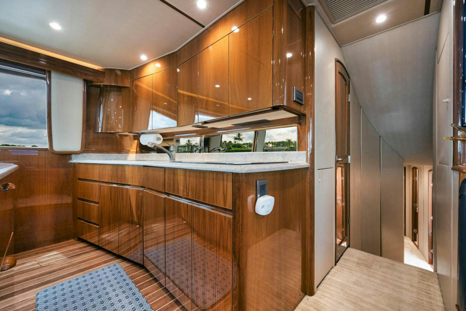a kitchen with wooden cabinets aboard SUNSHINE Yacht for Sale
