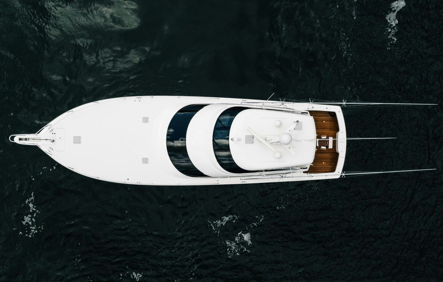 a white car with a white stripe aboard SUNSHINE Yacht for Sale