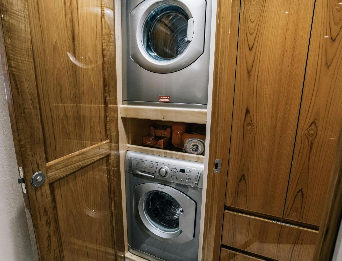 a kitchen with a washer and dryer aboard SUNSHINE Yacht for Sale