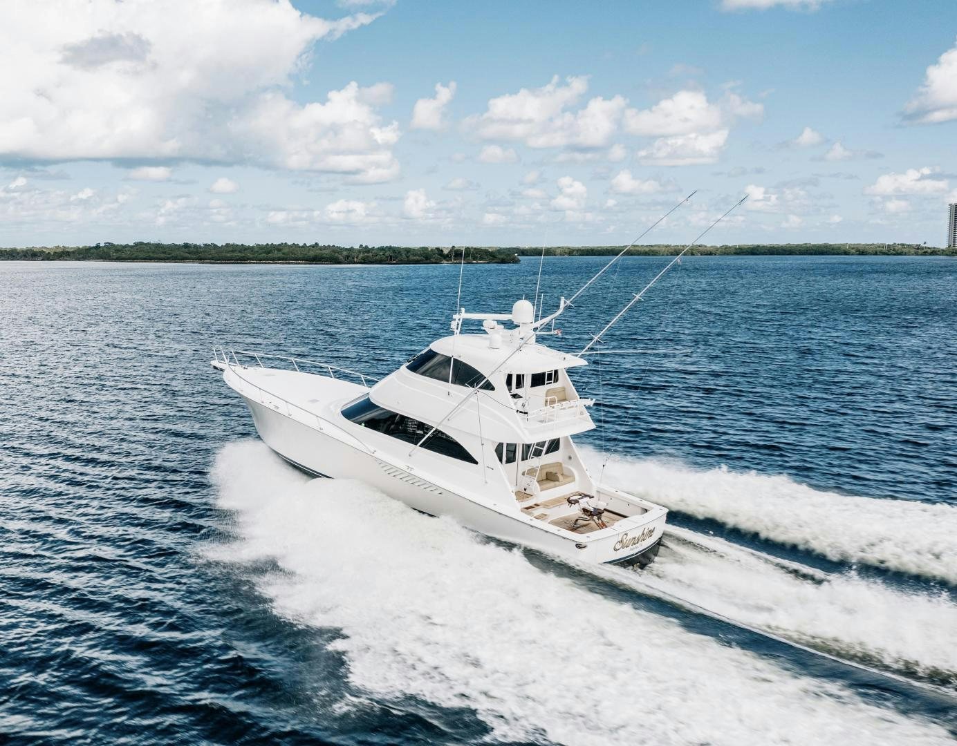 a white yacht on the water aboard SUNSHINE Yacht for Sale
