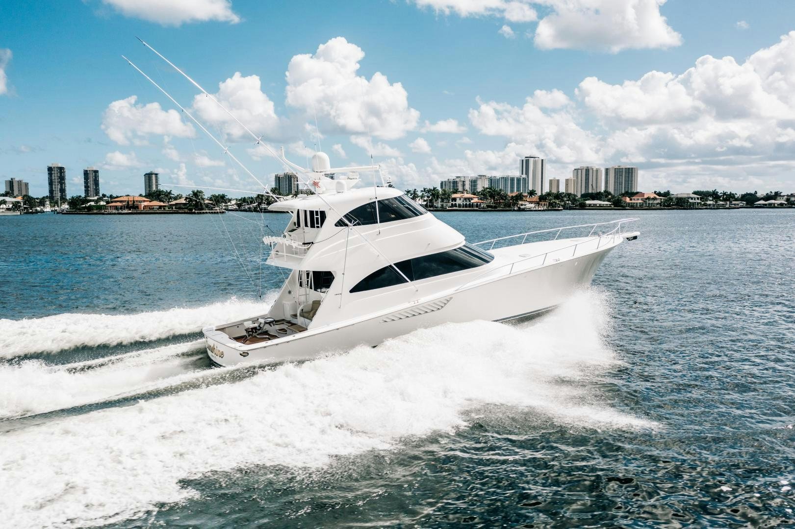 a white yacht on the water aboard SUNSHINE Yacht for Sale