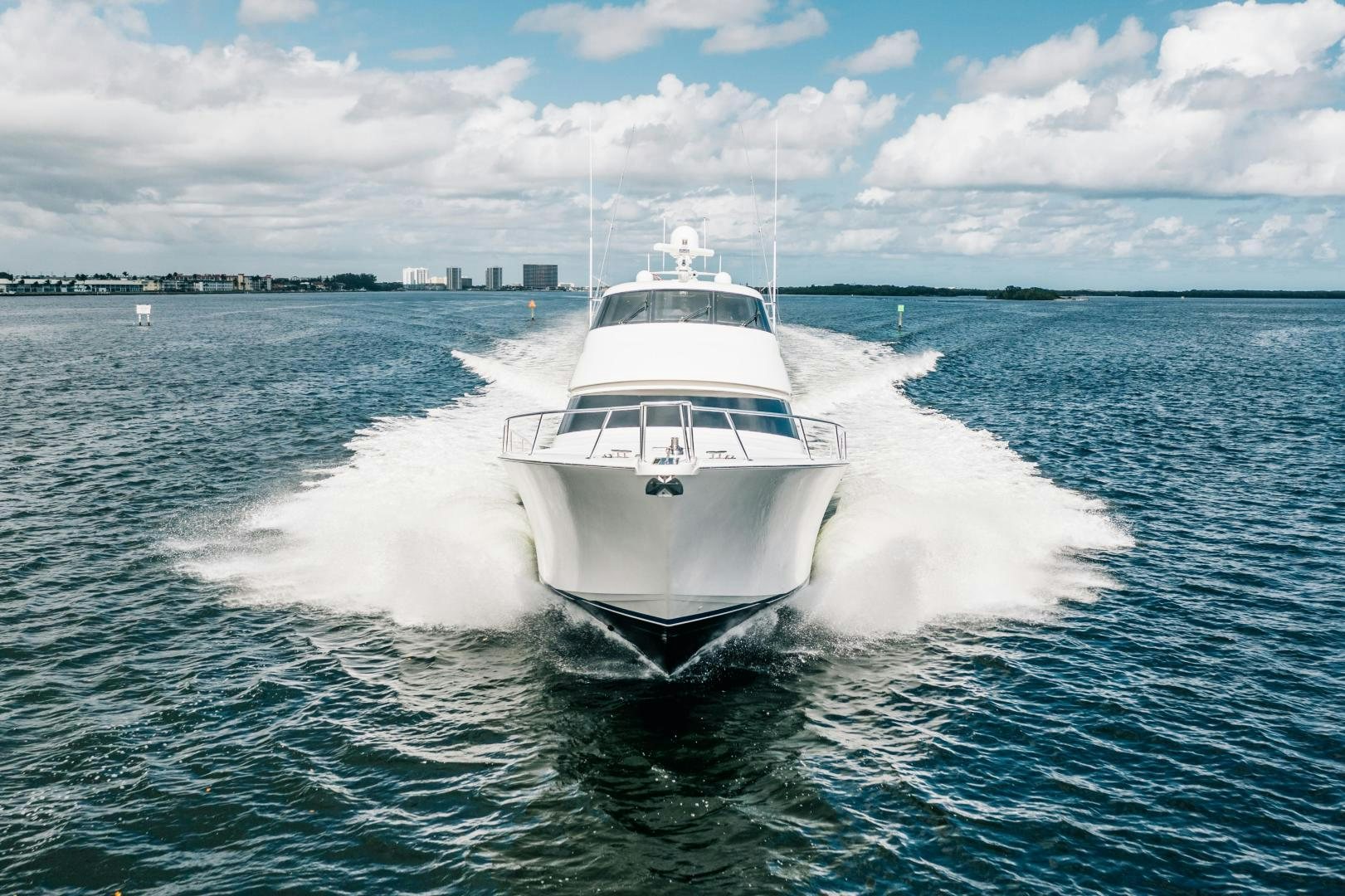 a white boat on the water aboard SUNSHINE Yacht for Sale
