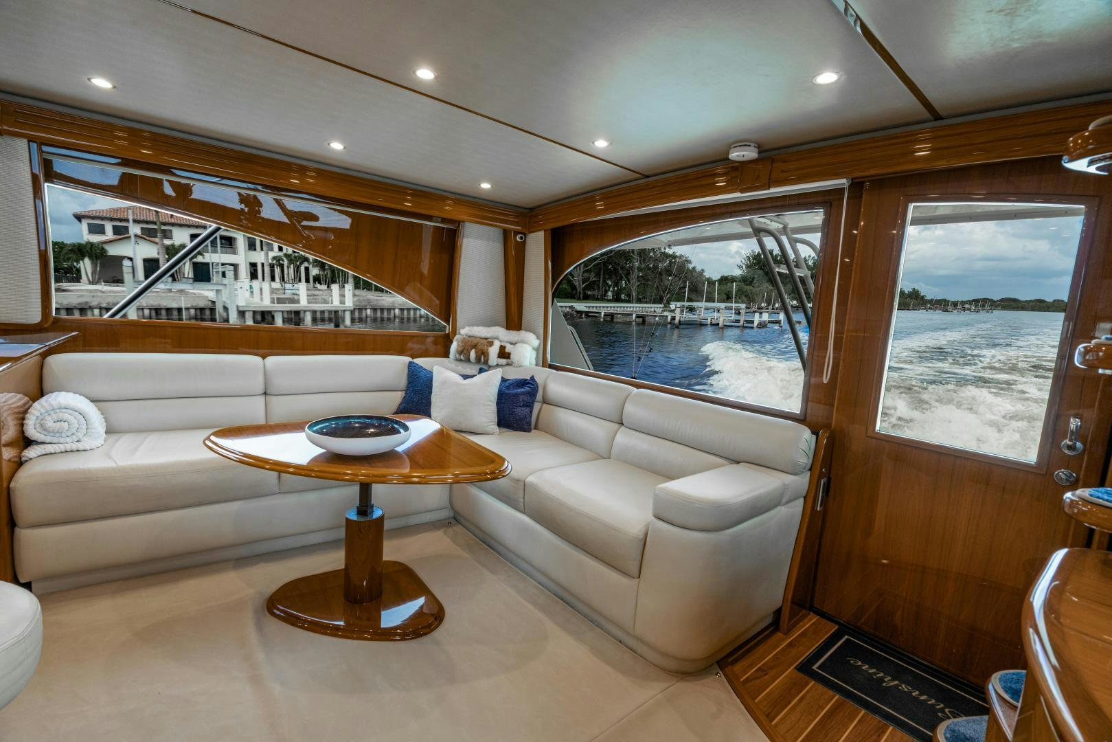 a living room with a couch and a table aboard SUNSHINE Yacht for Sale