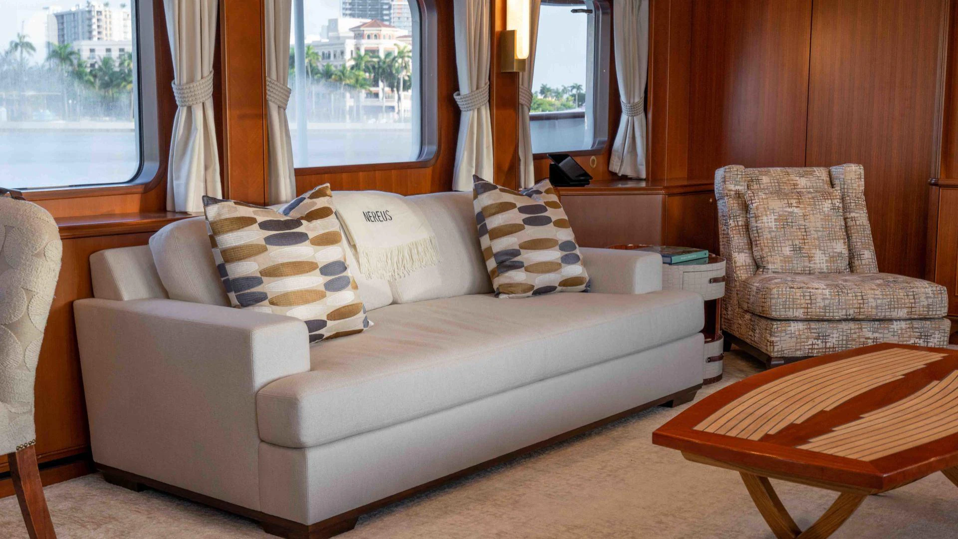 a couch and chairs in a room aboard NEREUS Yacht for Sale
