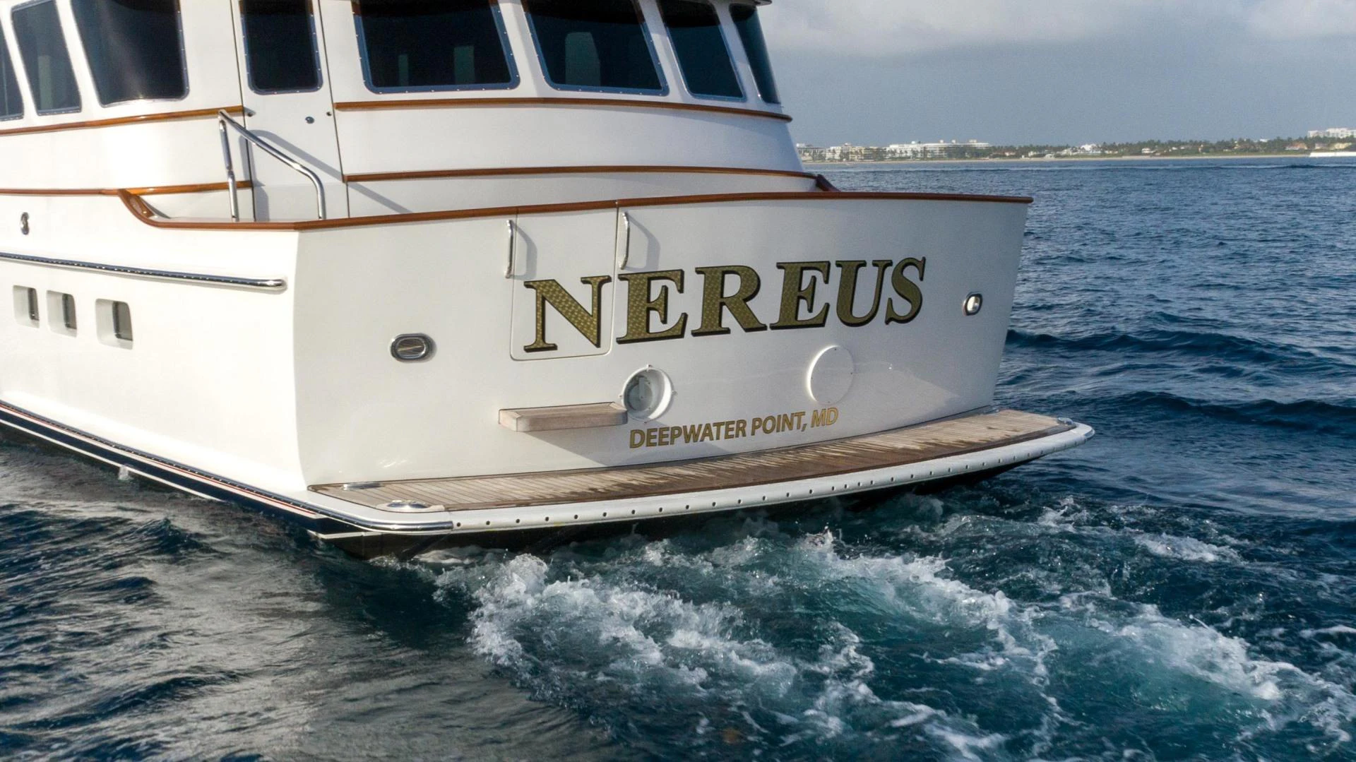 a white boat on the water aboard NEREUS Yacht for Sale