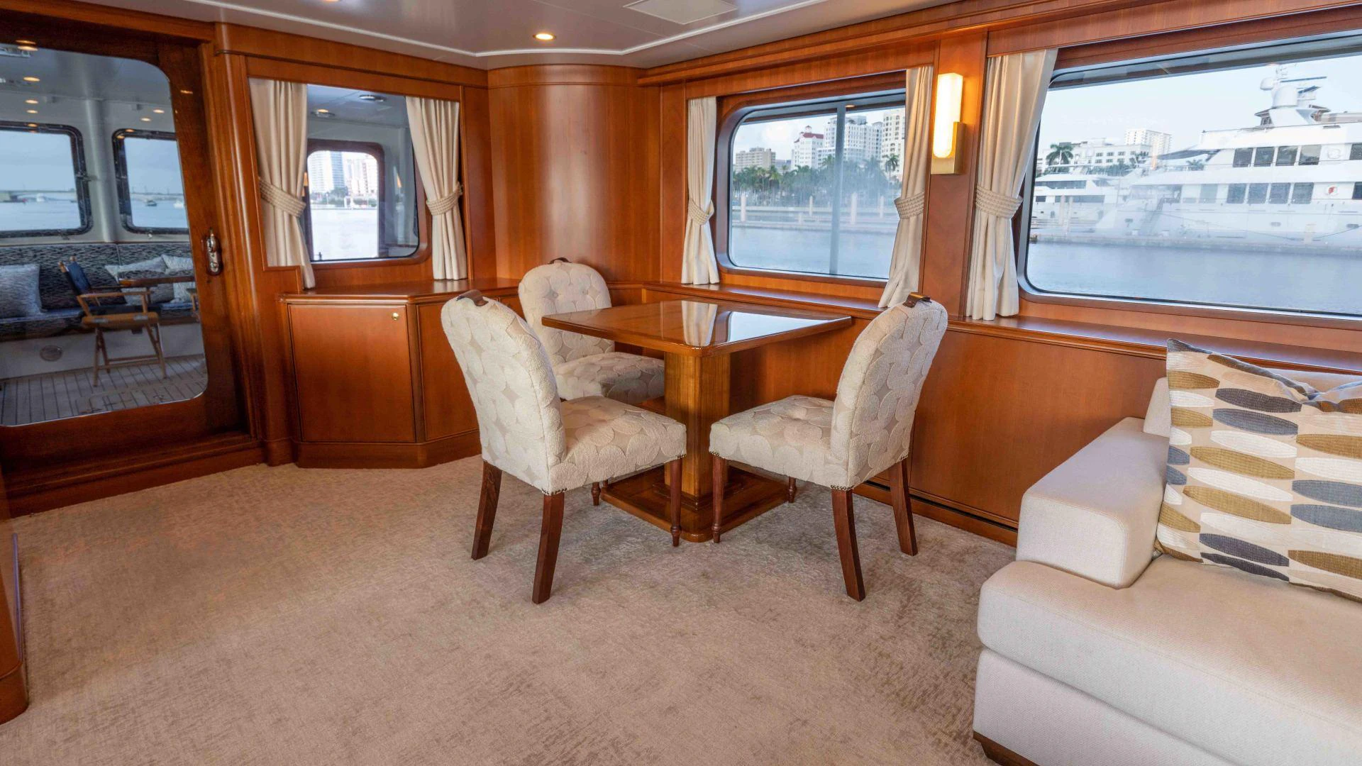 a room with a table chairs and a window aboard NEREUS Yacht for Sale