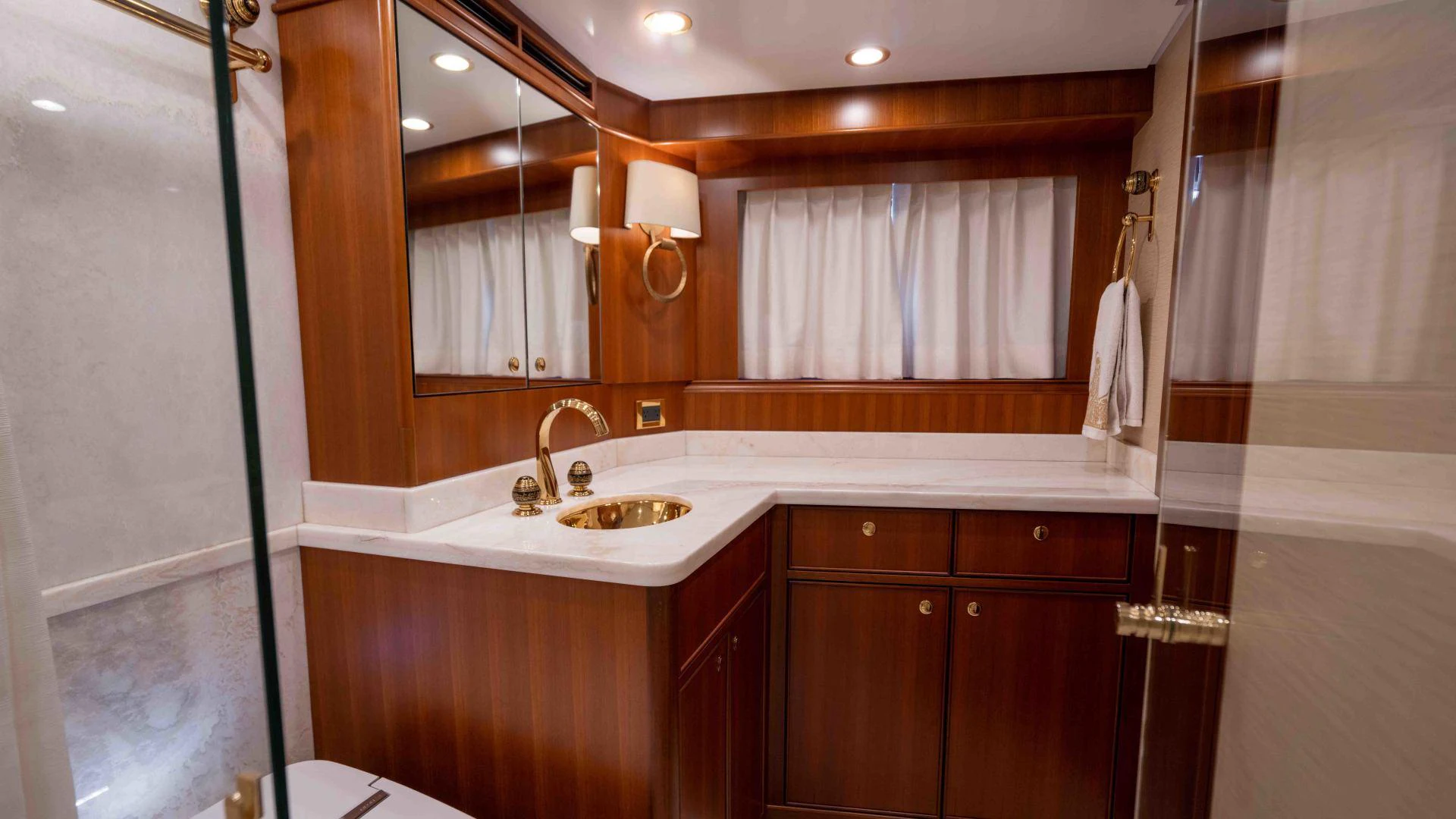 a bathroom with a sink and cabinets aboard NEREUS Yacht for Sale