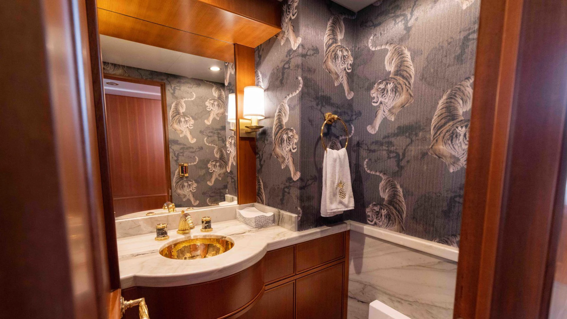 a bathroom with a sink and a large painting aboard NEREUS Yacht for Sale