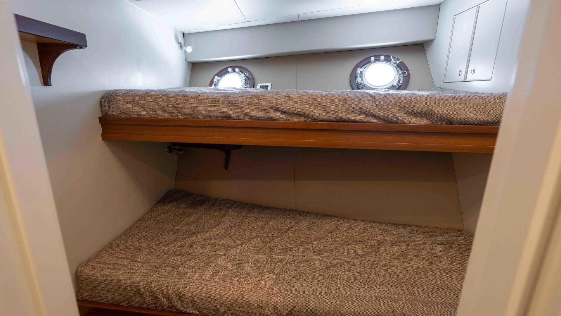 a wooden shelf with a round fan aboard NEREUS Yacht for Sale