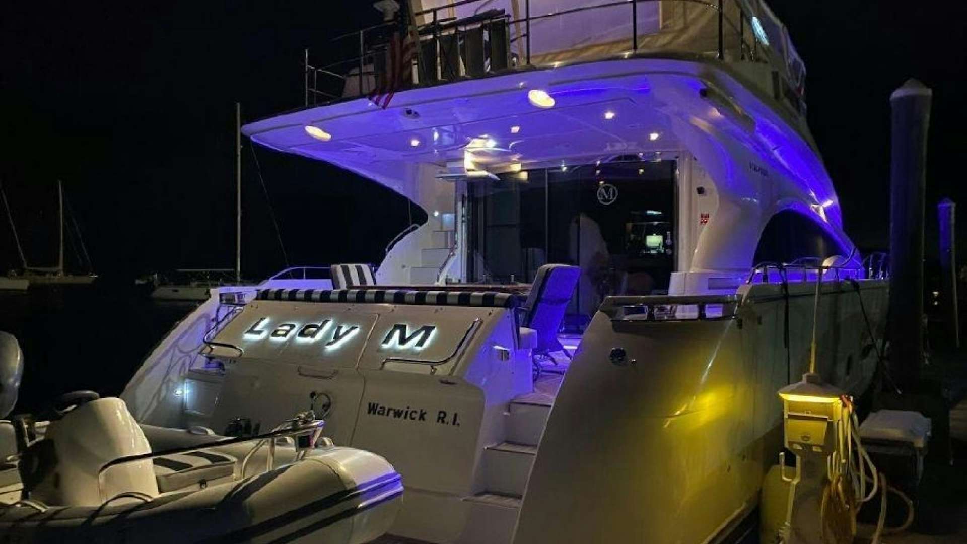 a large boat with lights on it aboard LADY M Yacht for Sale