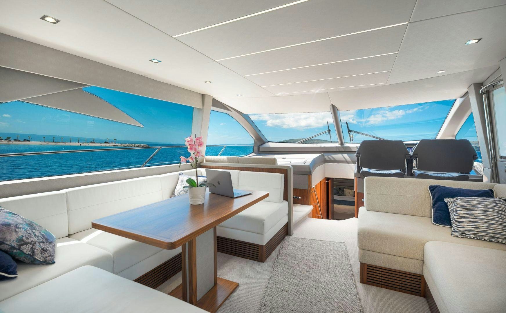 a room with a table and chairs aboard HIDEAWAY Yacht for Sale