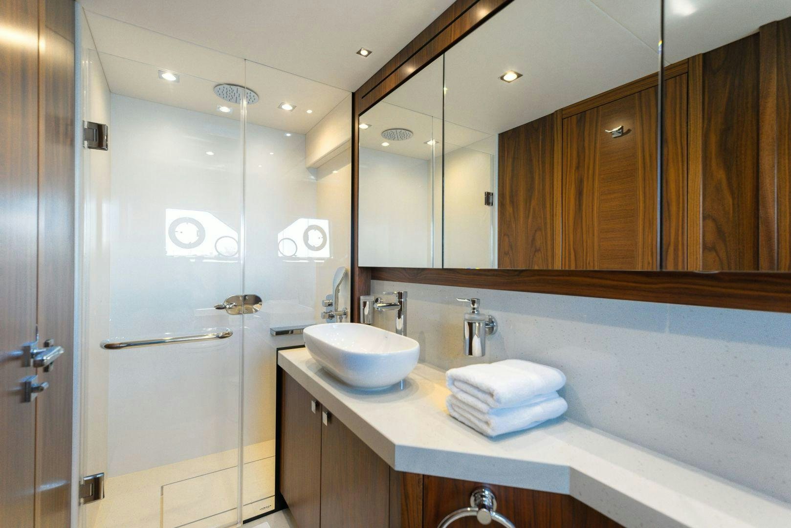 a bathroom with a sink and a mirror aboard HIDEAWAY Yacht for Sale