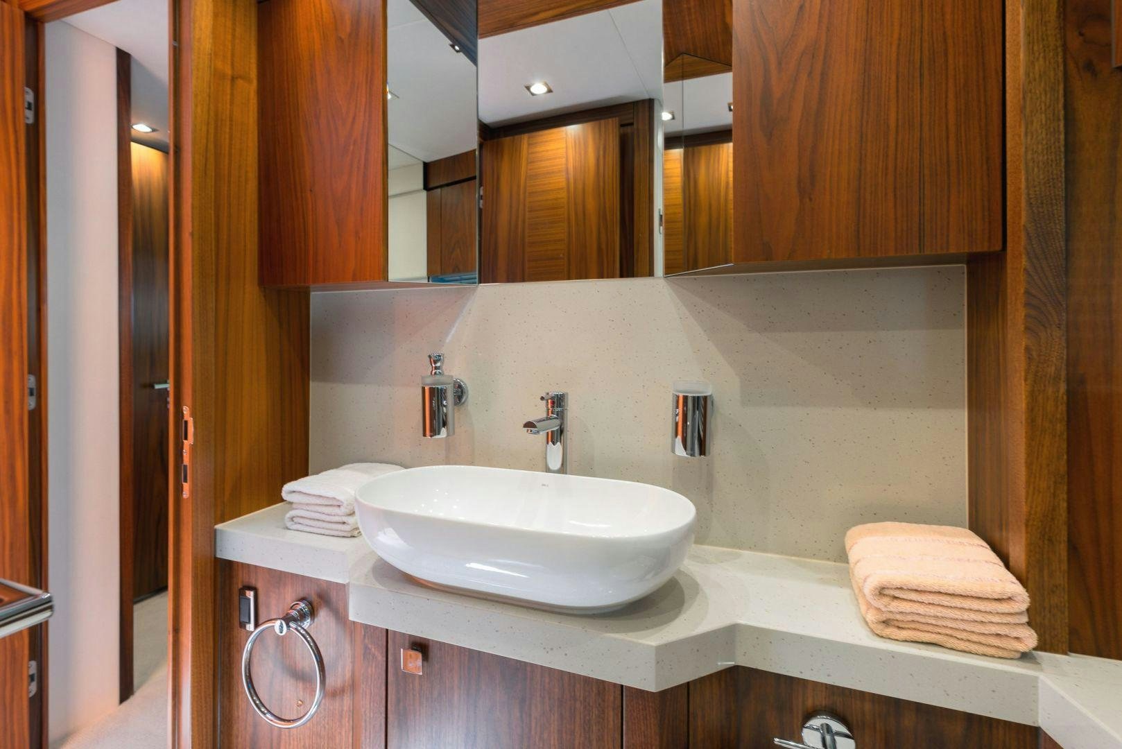a bathroom with a sink and a mirror aboard HIDEAWAY Yacht for Sale