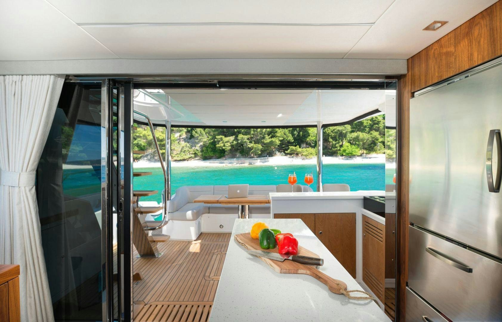 a modern looking living room with a pool and a deck aboard HIDEAWAY Yacht for Sale