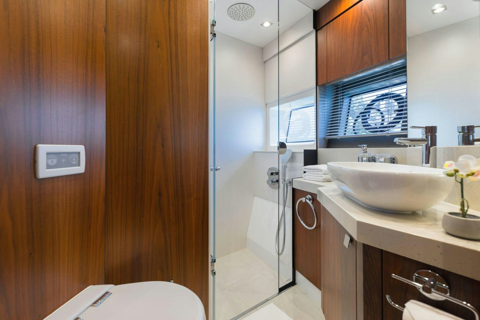 a bathroom with a sink and a mirror aboard HIDEAWAY Yacht for Sale