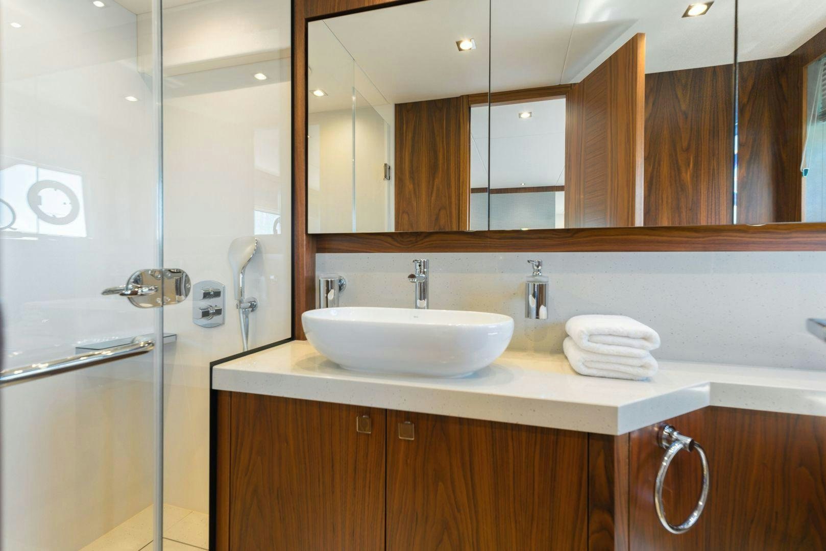 a bathroom with a sink and a mirror aboard HIDEAWAY Yacht for Sale