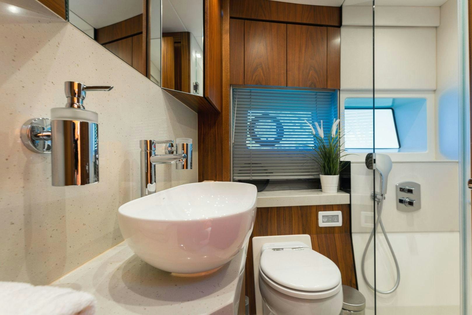 a bathroom with a sink and a toilet aboard HIDEAWAY Yacht for Sale
