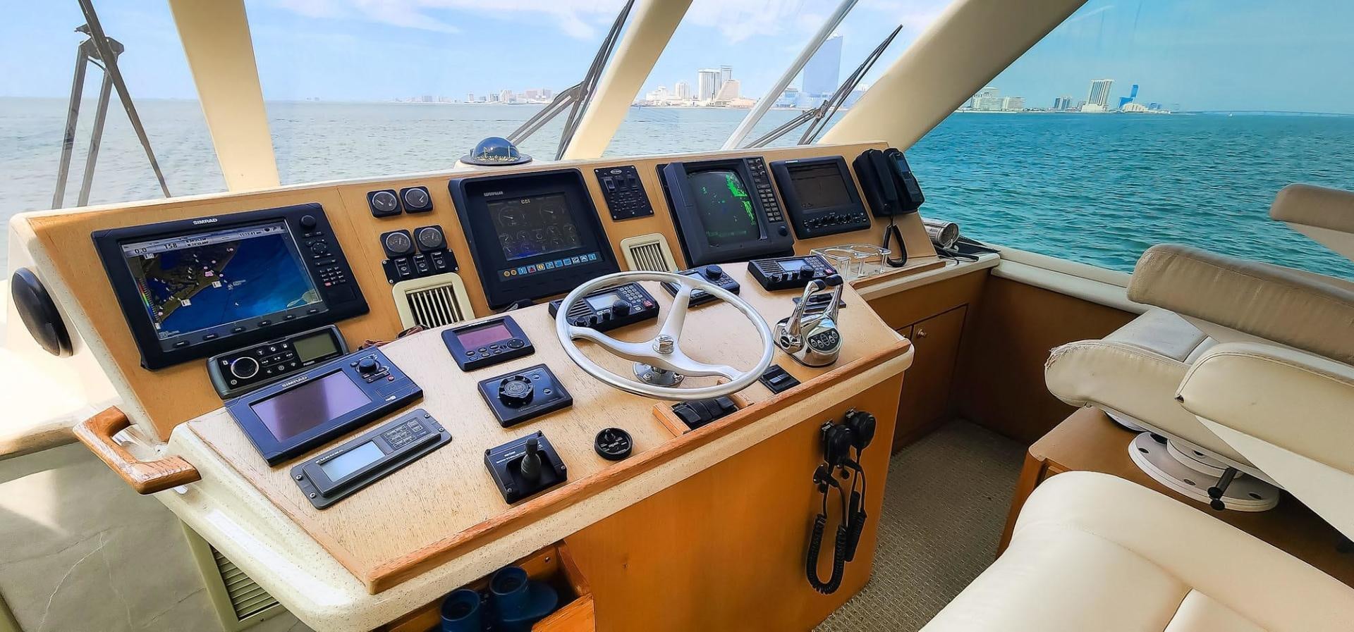 a table with laptops and headphones on it aboard My Time Yacht for Sale