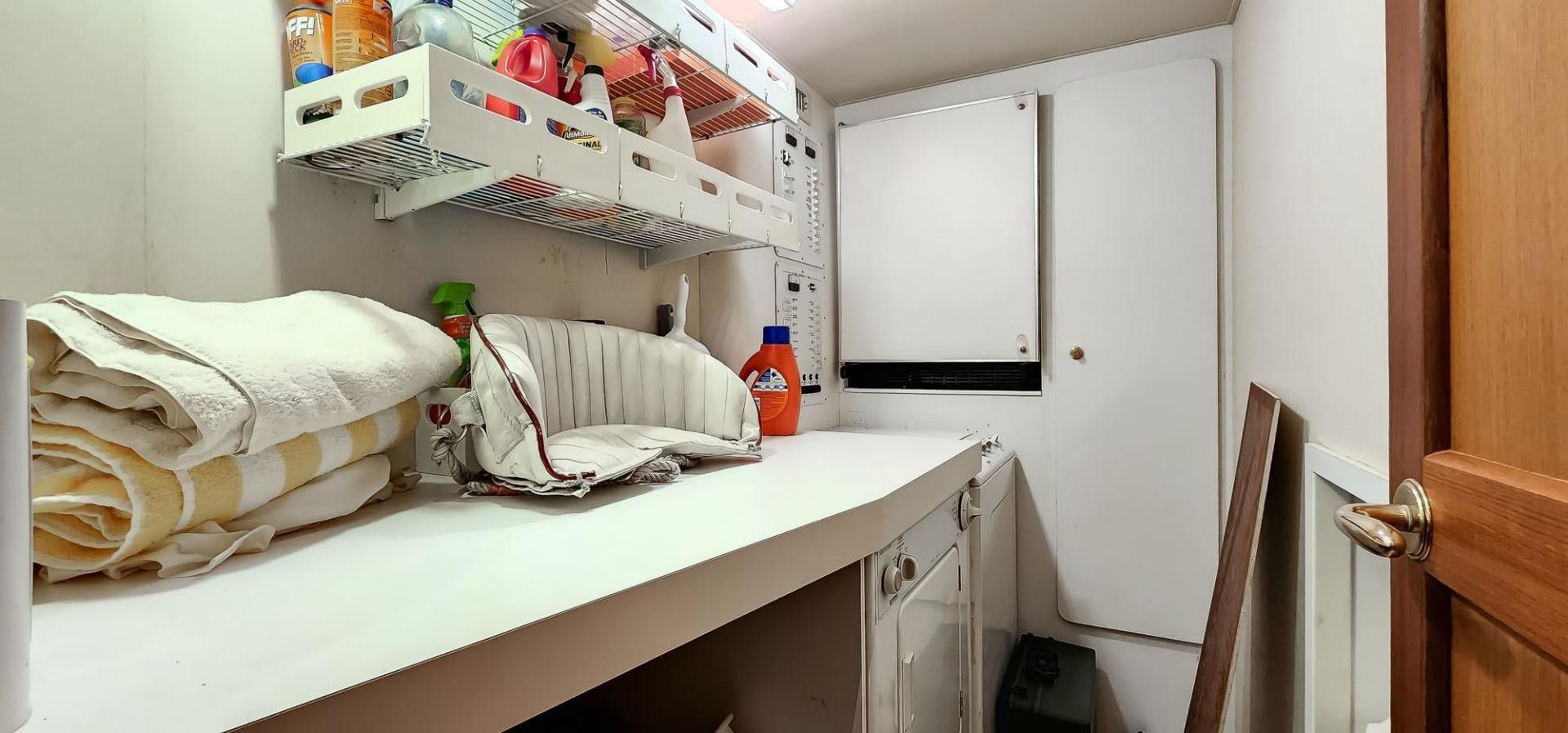 a kitchen with white cabinets aboard My Time Yacht for Sale