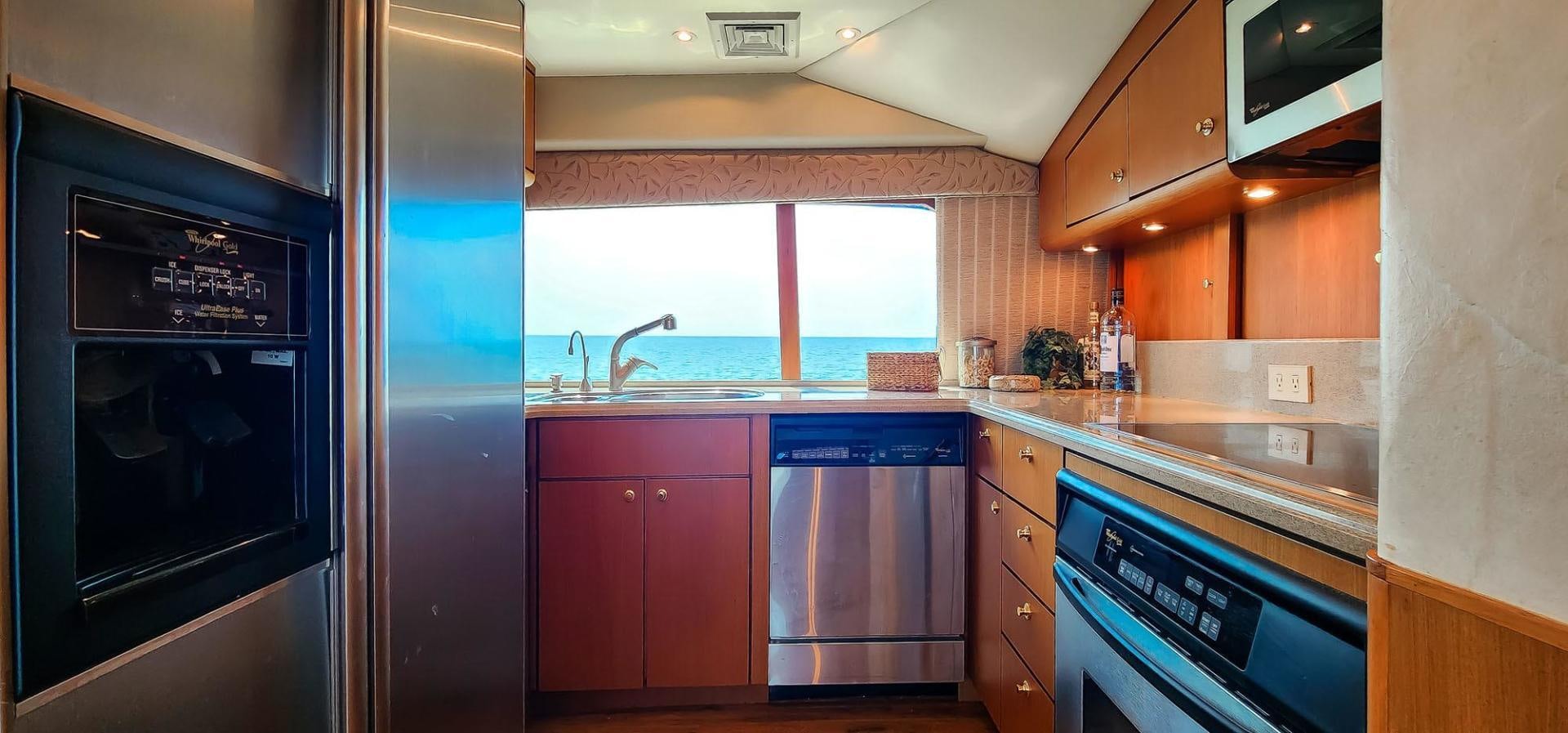 a kitchen with a stove and oven aboard My Time Yacht for Sale