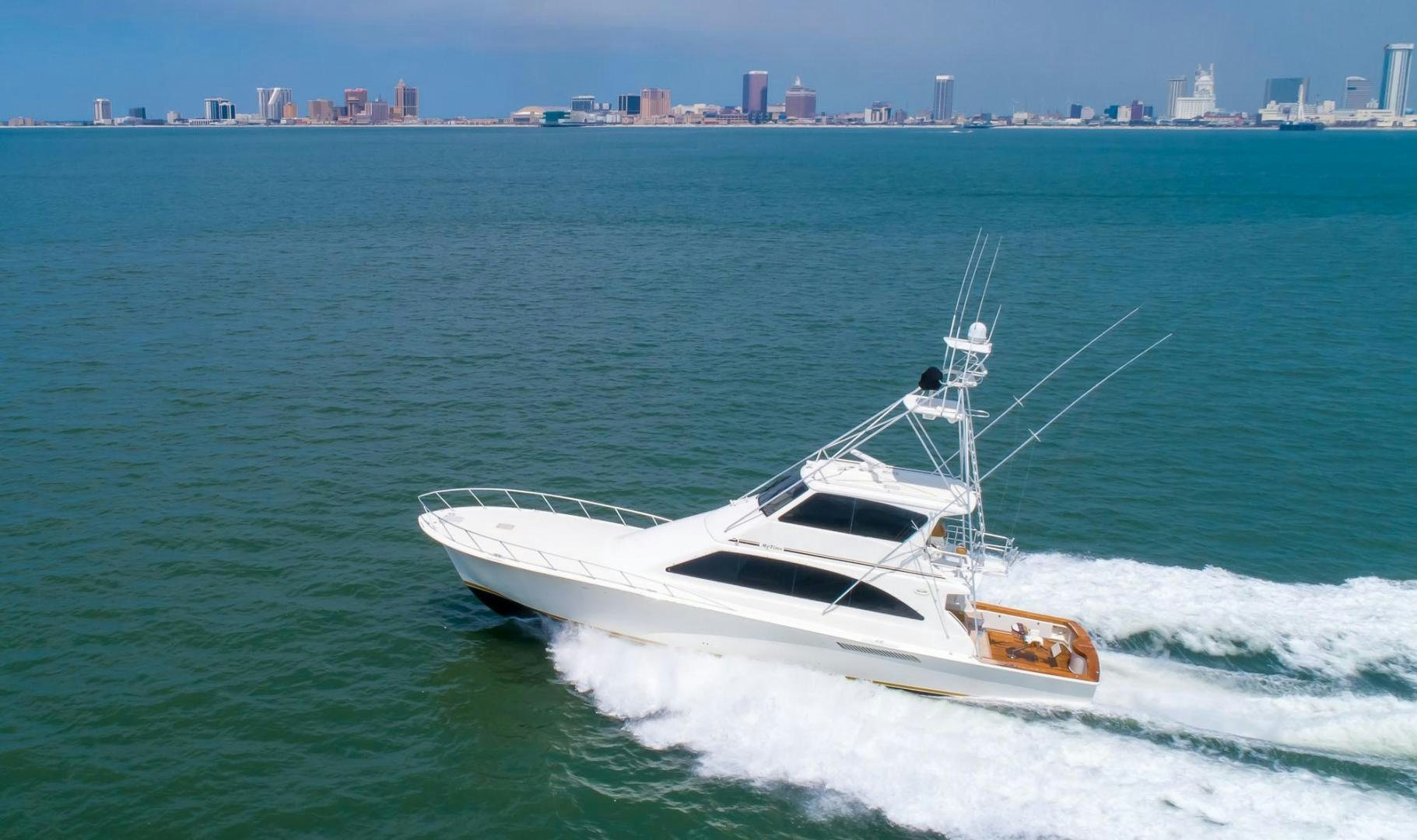 a white yacht on the water aboard My Time Yacht for Sale