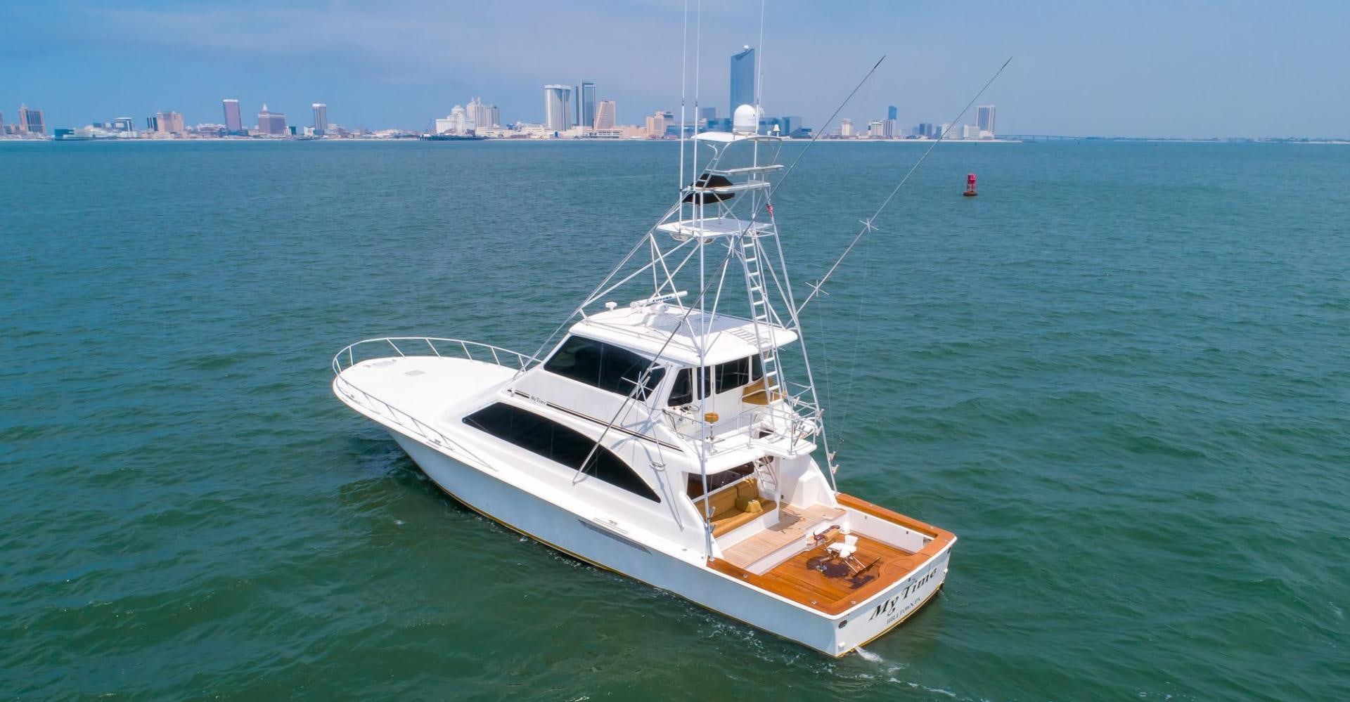 a white boat in the water aboard My Time Yacht for Sale