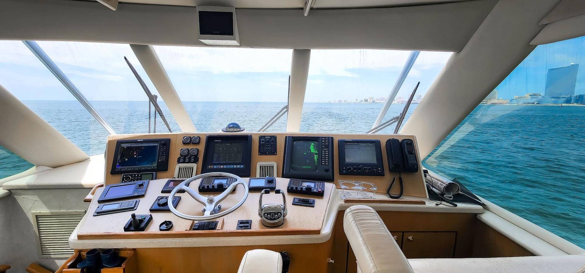 a boat with multiple monitors and a couple of monitors on it aboard My Time Yacht for Sale