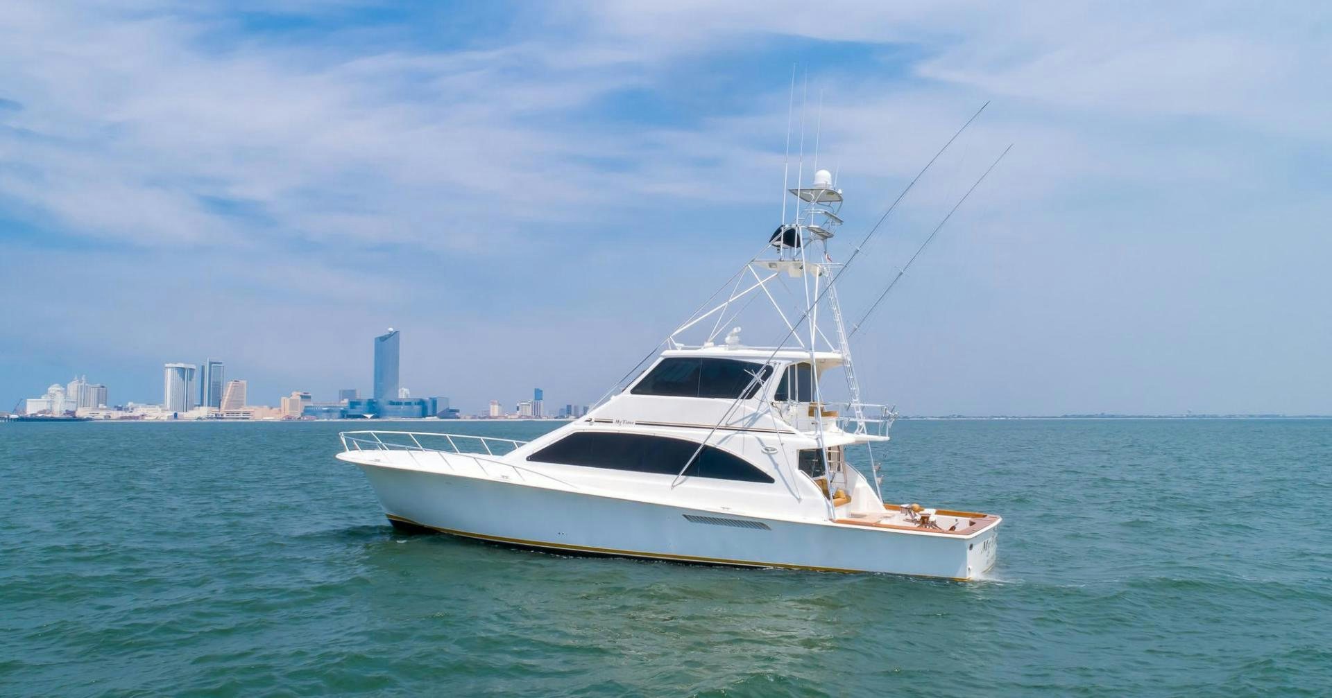 a white yacht in the water aboard My Time Yacht for Sale