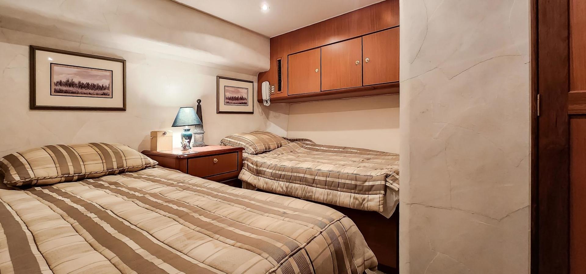 a couple of beds in a room aboard My Time Yacht for Sale