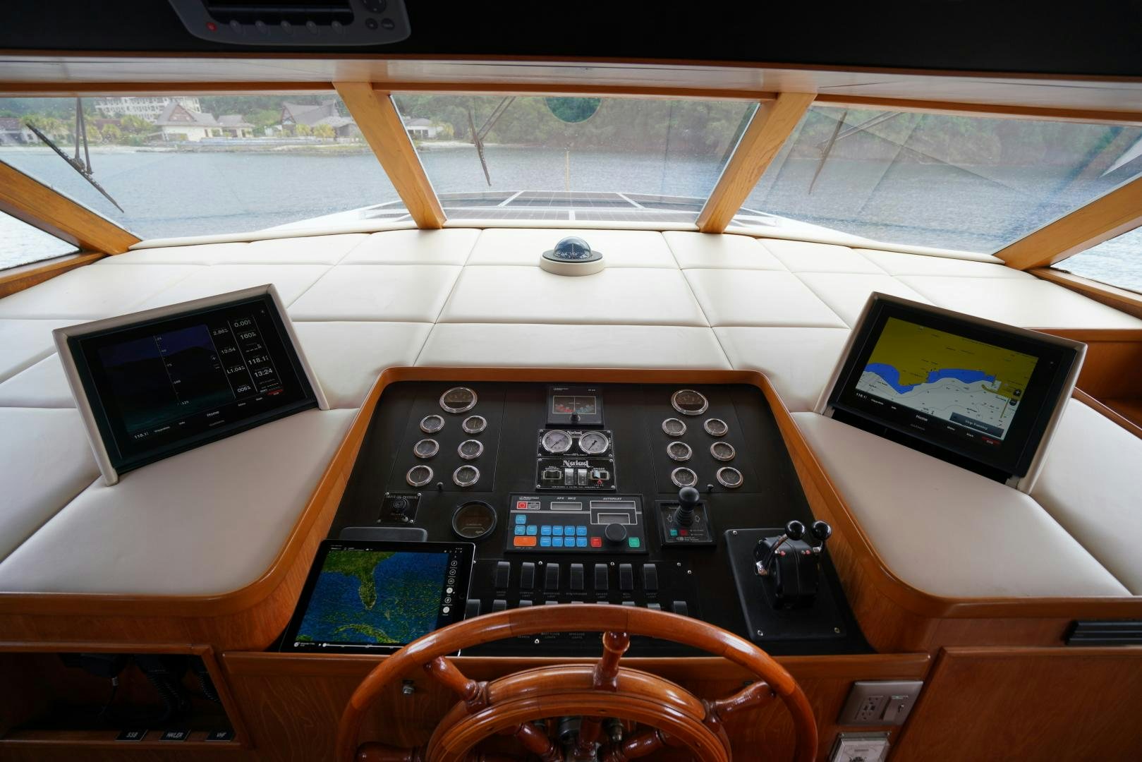 a control panel on a table aboard GOLDEN RULE Yacht for Sale