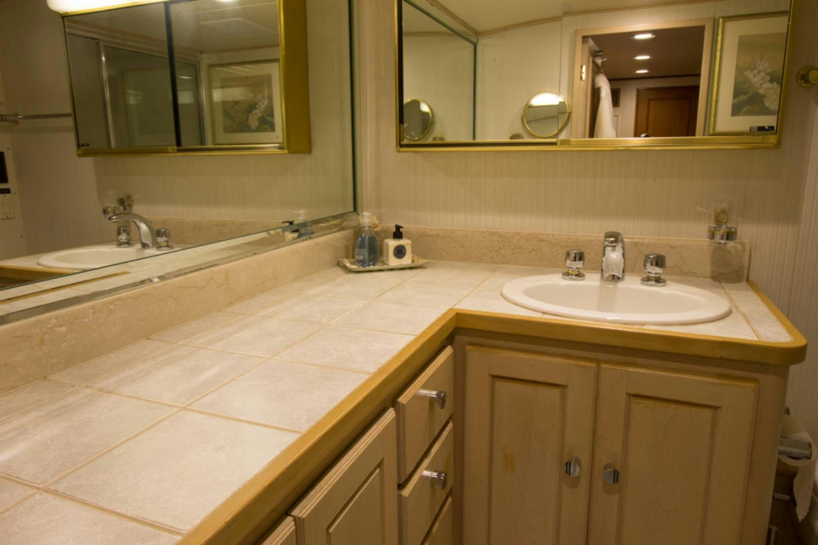 a bathroom with a countertop sink and mirror aboard GOLDEN RULE Yacht for Sale