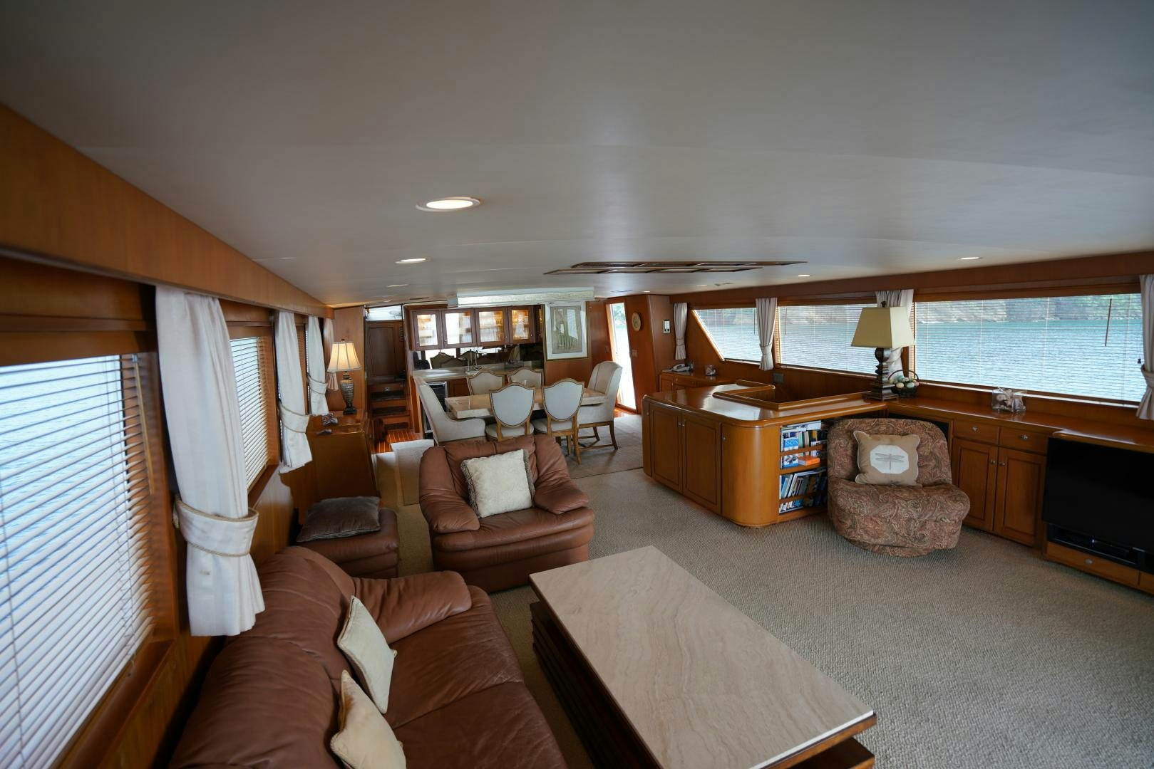a living room with a couch and a television aboard GOLDEN RULE Yacht for Sale