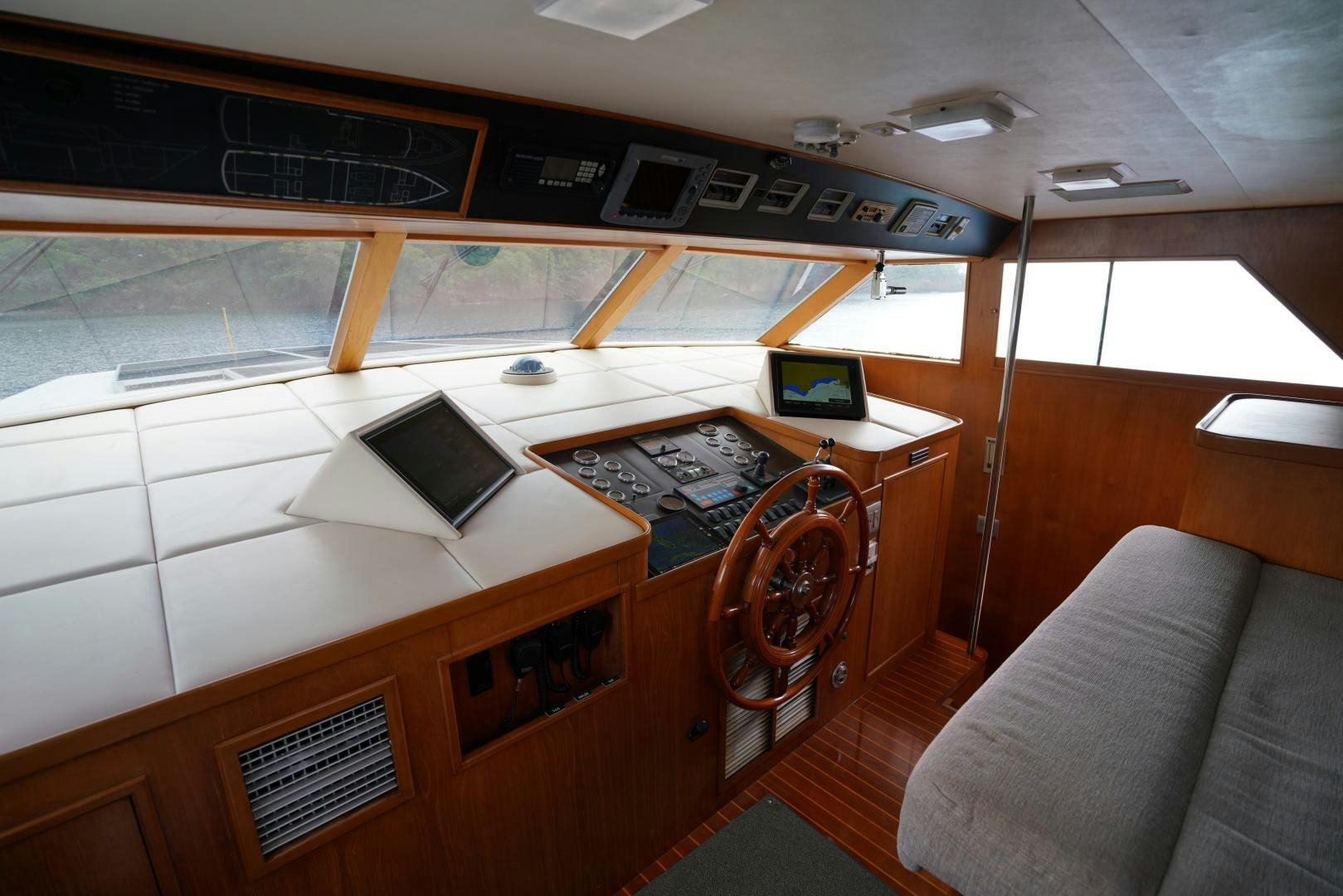 a room with a couch and a television aboard GOLDEN RULE Yacht for Sale
