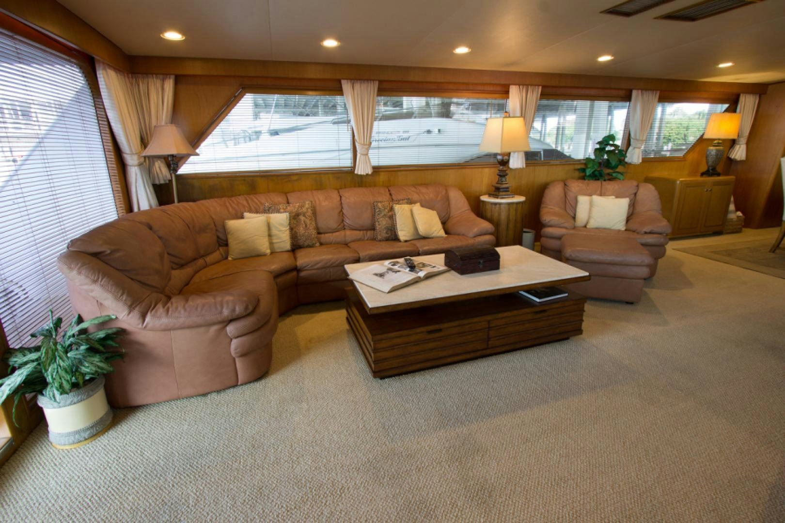 a living room with a couch and a coffee table aboard GOLDEN RULE Yacht for Sale