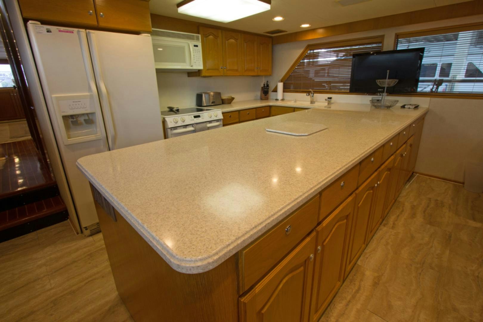 a large kitchen with a large island aboard GOLDEN RULE Yacht for Sale
