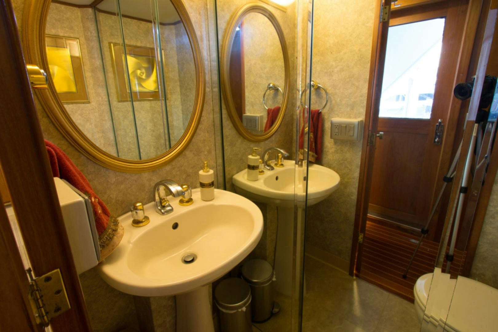 a bathroom with a sink and a mirror aboard GOLDEN RULE Yacht for Sale