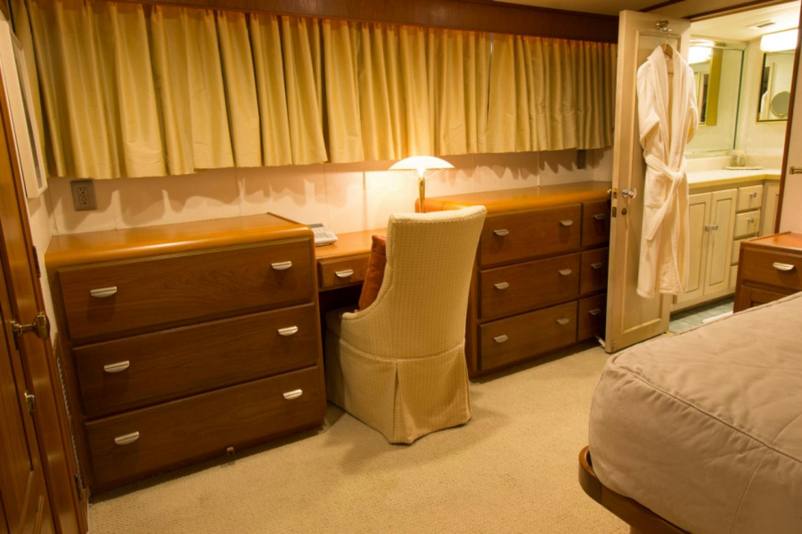 a room with a dresser and a bed aboard GOLDEN RULE Yacht for Sale