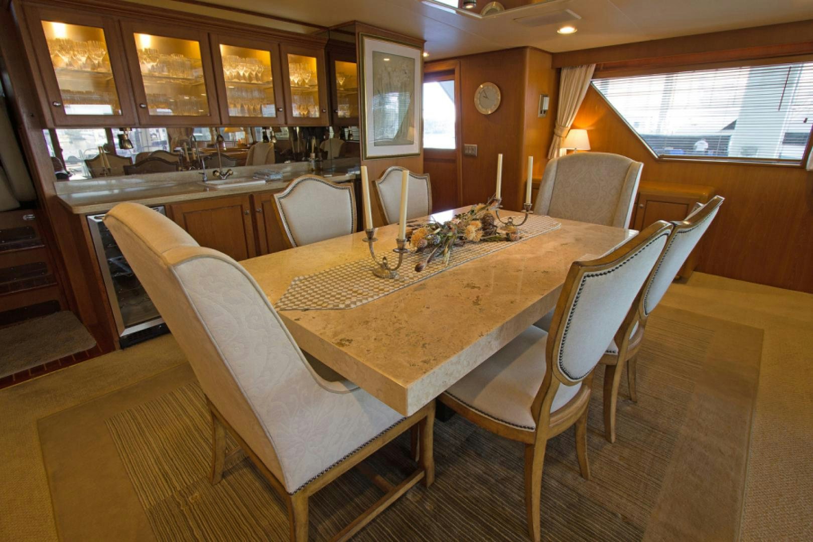 a dining table in a restaurant aboard GOLDEN RULE Yacht for Sale
