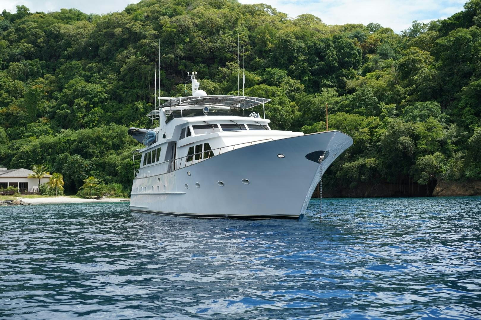 a white boat in the water aboard GOLDEN RULE Yacht for Sale