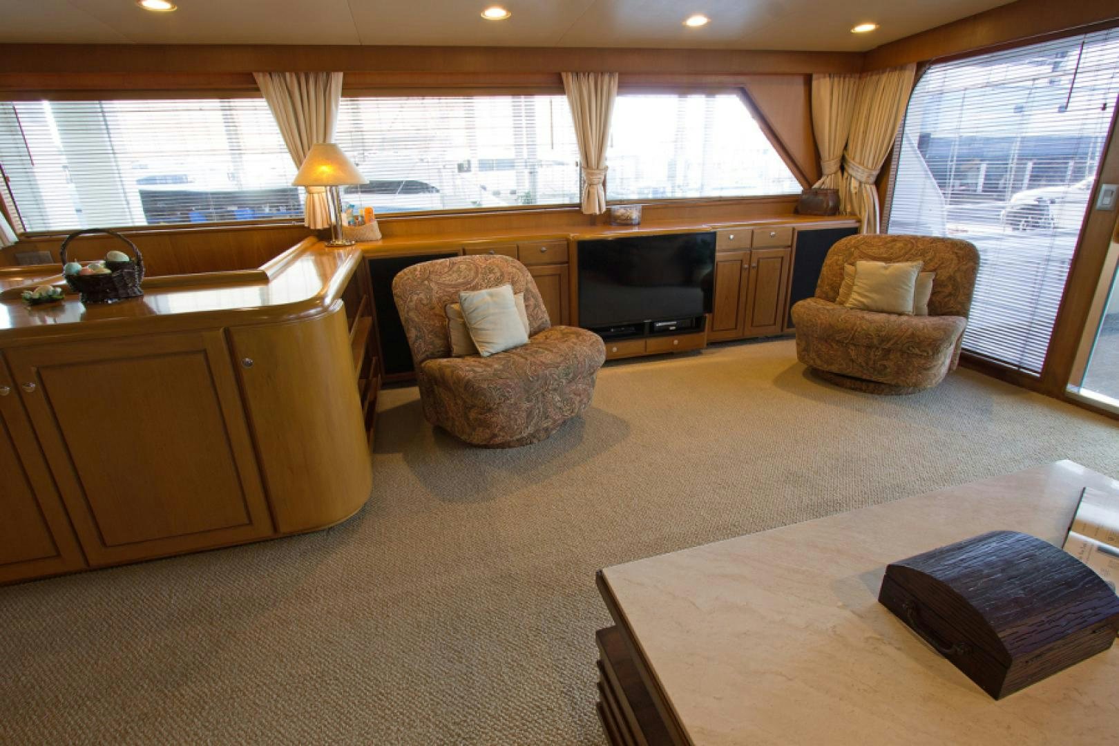 a living room with a couch and a tv aboard GOLDEN RULE Yacht for Sale