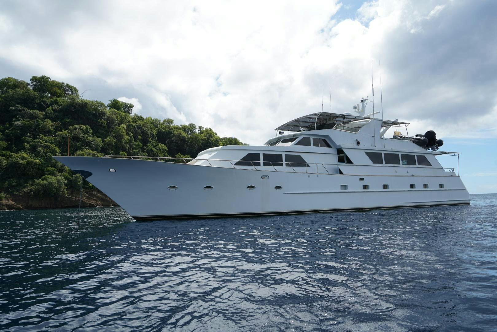 a white yacht on the water aboard GOLDEN RULE Yacht for Sale