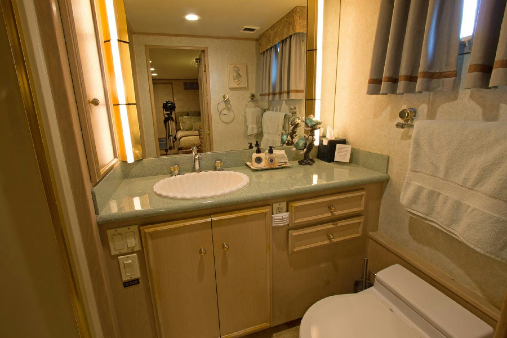 a bathroom with a countertop sink and a mirror aboard GOLDEN RULE Yacht for Sale