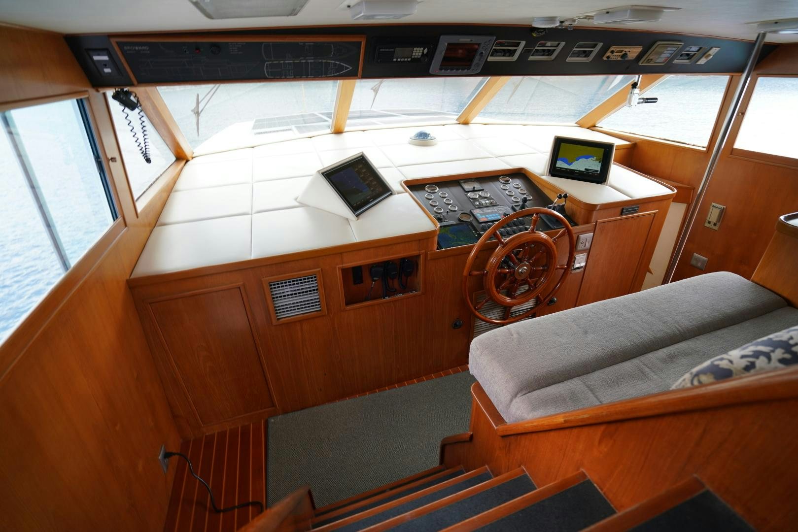 a room with a couch and a table aboard GOLDEN RULE Yacht for Sale