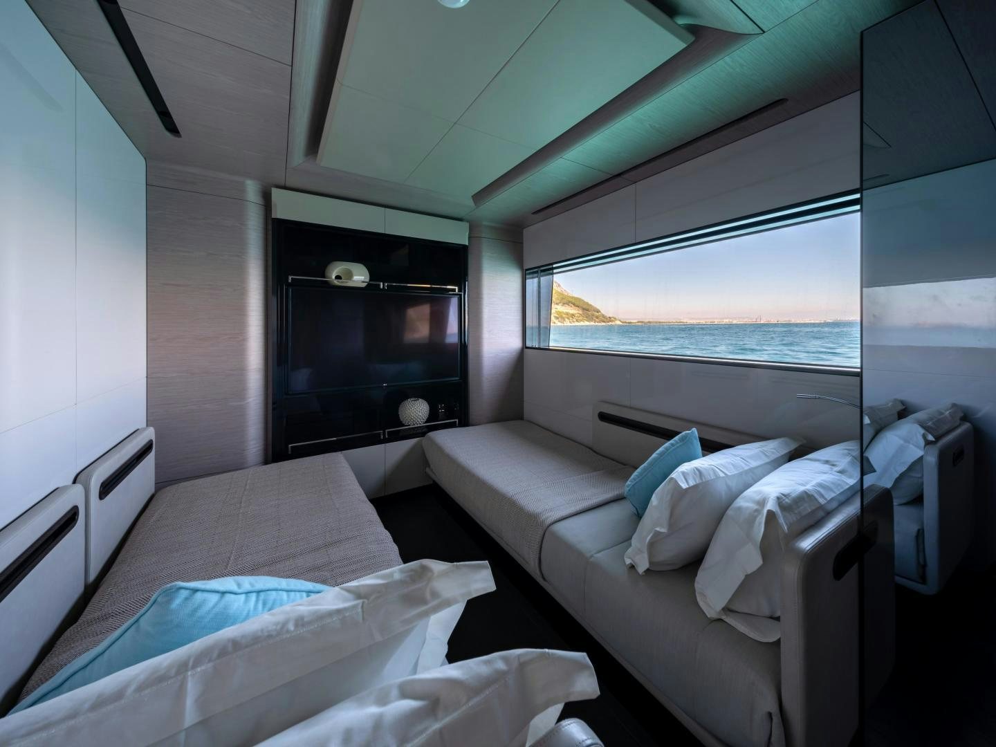 a room with a bed and a television aboard EDGE   NB 201 Yacht for Sale